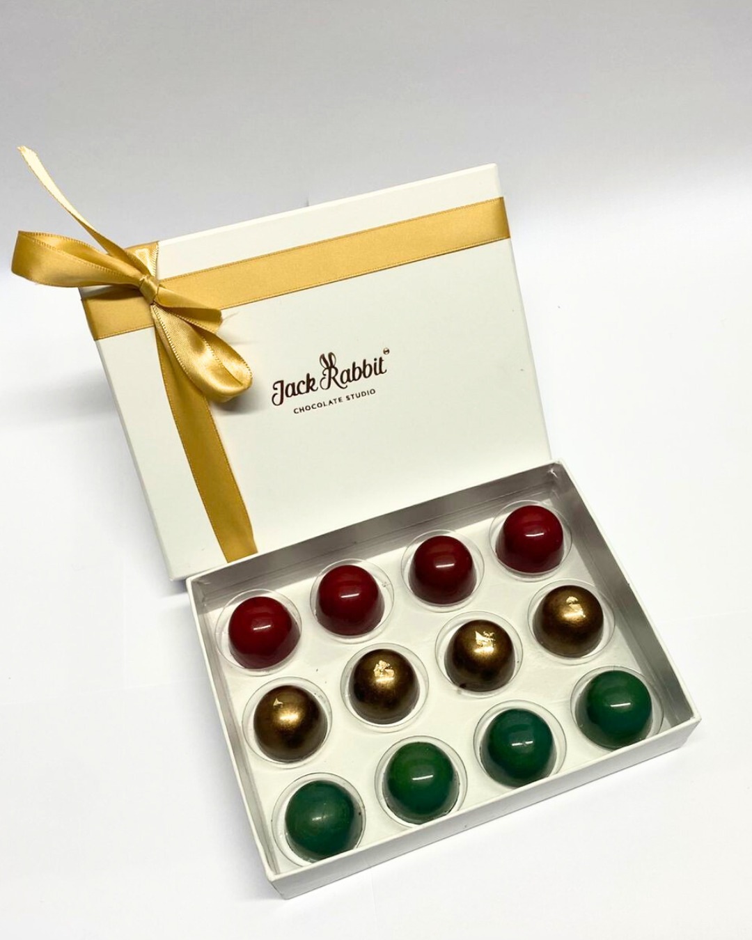 Luxury Christmas bonbons by Jack Rabbit Chocolate Studio – handcrafted artisan chocolates in festive flavours Peppermint Crisp Pudding, Christmas Cracker Crunch, and Eggnog.